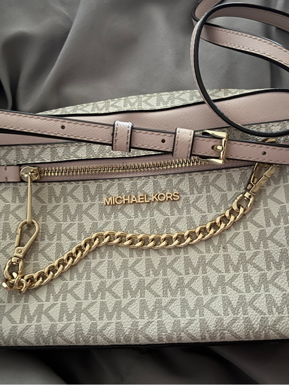 Michael Kors Beige and Pale Pink small crossbody purse.